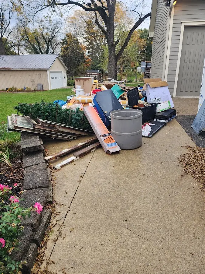 Dumpster being loaded with debris for 10 Yard Dumpster Rental in Susquehanna